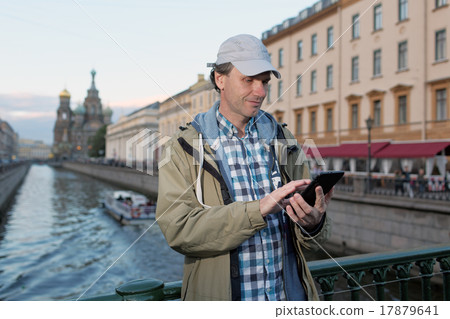 Tourist with a tablet in St. Petersburg, Russia Tourist with a tablet in St. Petersburg, Russia 17879641