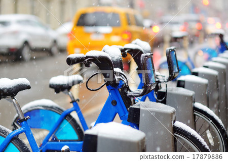 Rental city bikes covered with snow in New York Rental city bikes covered with snow in New York 17879886