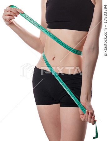 Girl measures the waist. Weight loss. Girl measures the waist. Weight loss. 17883894