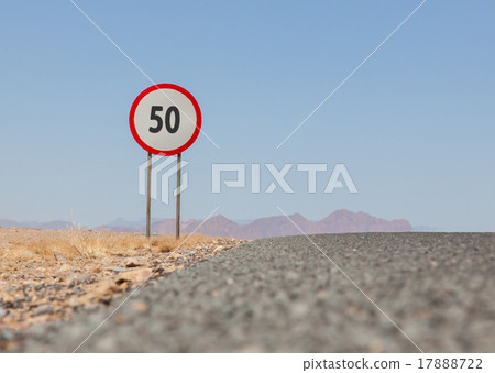 Speed limit sign at a desert road in Namibia 17888722