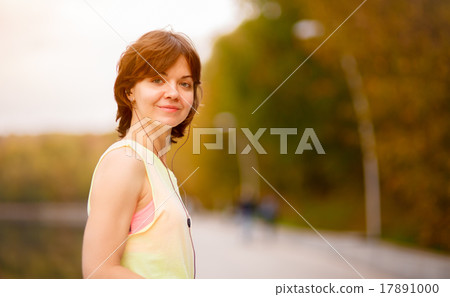 woman with mp3 player doing fitness woman with mp3 player doing fitness 17891000