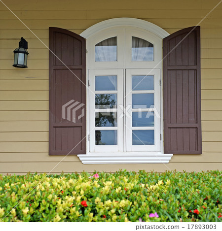 vintage window on wooden wall 17893003