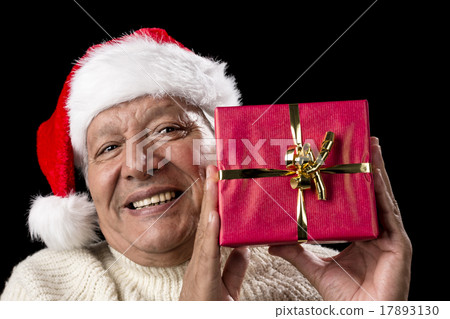 Smiling Old Man With Red Wrapped Christmas Gift 17893130