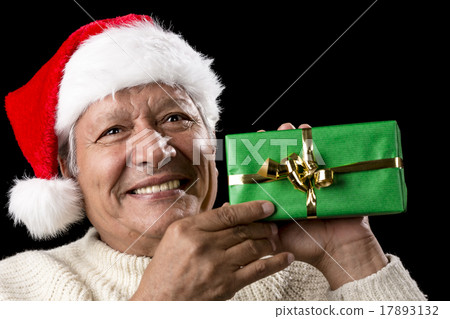 Elderly Man with Santa Cap And Green Wrapped Gift 17893132