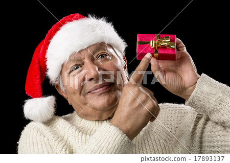 Male Senior With Red Pompom Hat And Christmas Gift Male Senior With Red Pompom Hat And Christmas Gift 17893137