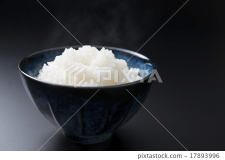 A cup of rice and bowls 17893996