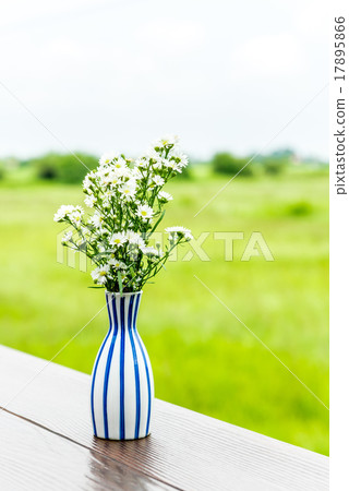 White flower vase on the table  17895866