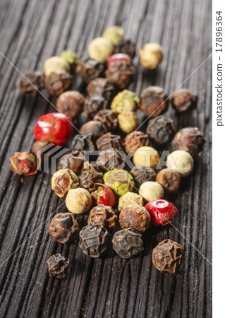 pepper corns on a wooden board pepper corns on a wooden board 17896364