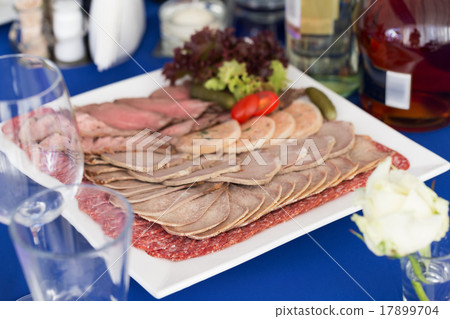 Served table layout with meat snack plate Served table layout with meat snack plate 17899704