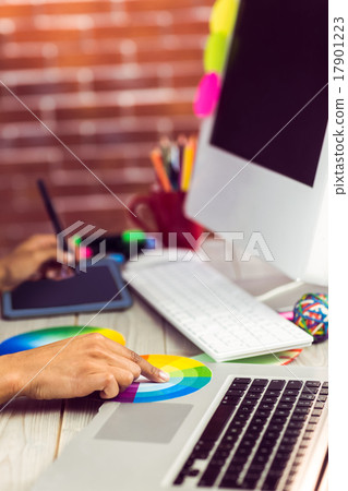 Graphic designer working with colour chart and digitizer 17901223