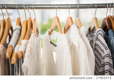 Stock Photo: Clothes on clothes rail