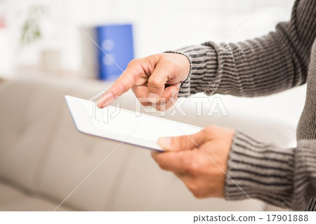 Close up view of hands using tablet 17901888