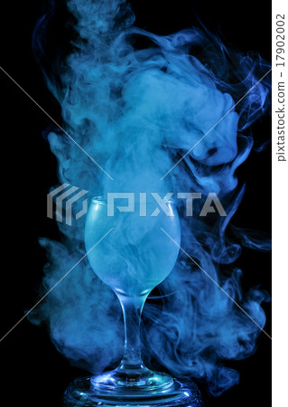 Aquamarine smoke in a glass. Halloween. Aquamarine smoke in a glass. Halloween. 17902002