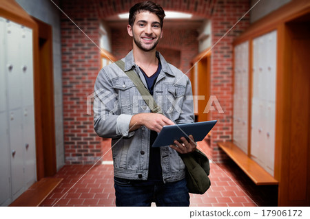 Composite image of student using tablet in library Composite image of student using tablet in library 17906172