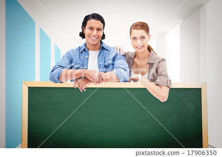 Composite image of couple leaning on blank wall Composite image of couple leaning on blank wall 17906350