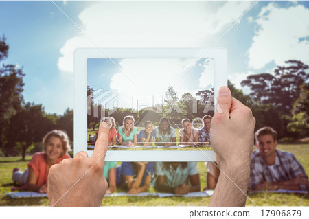 Composite image of hand holding tablet pc 17906879