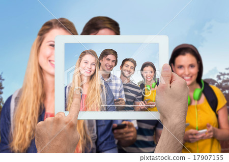 Composite image of hand holding tablet pc 17907155