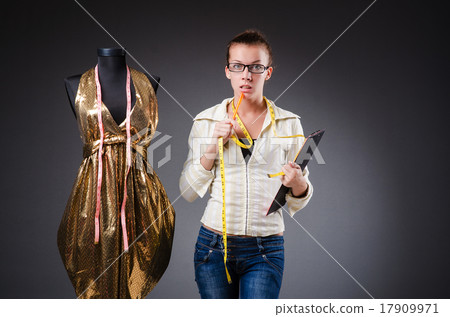 Woman tailor working on clothing Woman tailor working on clothing 17909971