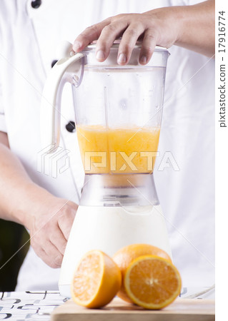 Chef making Orange juice smoothie Chef making Orange juice smoothie 17916774