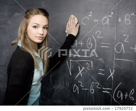 young pretty girl student in classroom at young pretty girl student in classroom at 17920752
