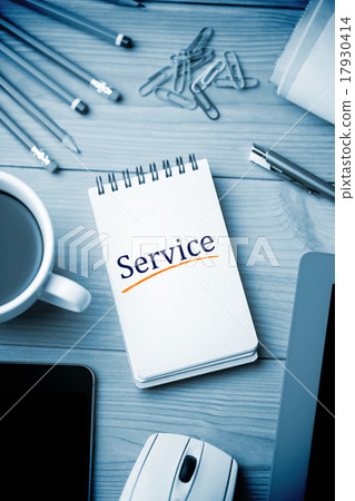 Service against notepad on desk 17930414