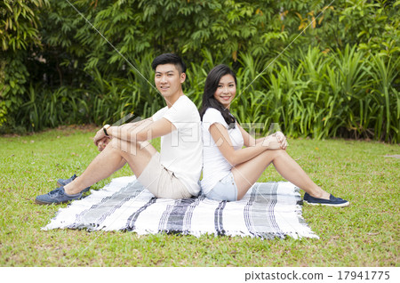 An Asian couple getting together in a park. An Asian couple getting together in a park. 17941775