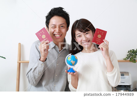 A young couple with a passport A young couple with a passport 17944989