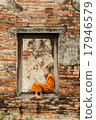 Novice monk reading  books in ruins. 17946579