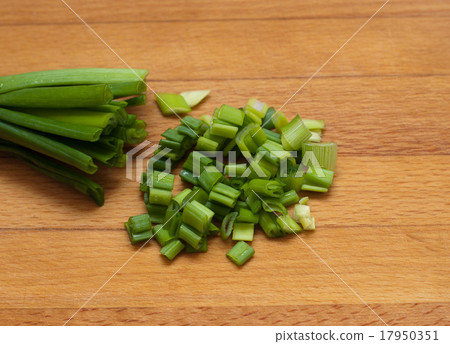 green onion chives  on wooden board 17950351