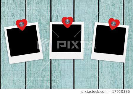 Blank old photos on clips on color wood background 17950386