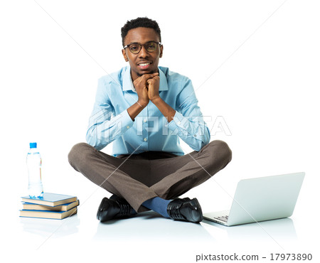 Happy african american college student with laptop Happy african american college student with laptop 17973890