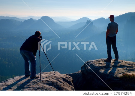 Tourist guide and photo enthusiast stay at tripod Tourist guide and photo enthusiast stay at tripod 17974294