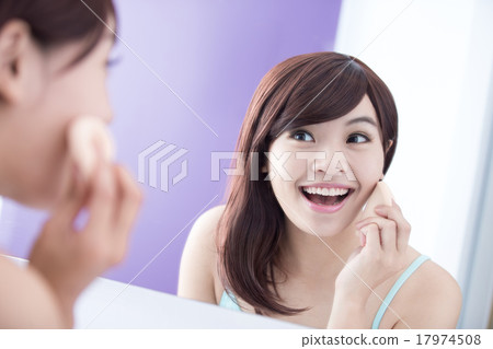 Smile woman with cosmetic sponge Smile woman with cosmetic sponge 17974508