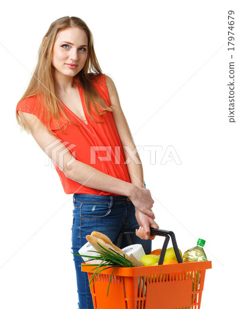 Woman holding a basket full of healthy food 17974679