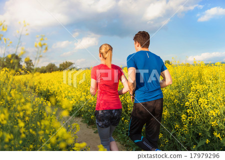 Young couple running Young couple running 17979296