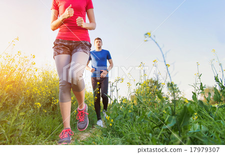 Young couple running Young couple running 17979307