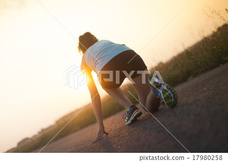Runner feet running on road closeup on shoe Runner feet running on road closeup on shoe 17980258