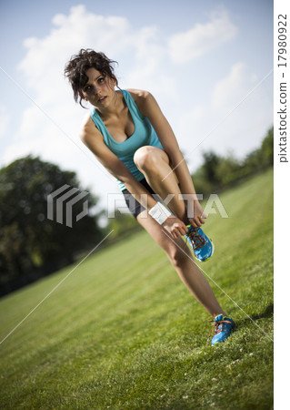Runner feet running on road closeup on shoe Runner feet running on road closeup on shoe 17980922