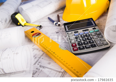 Hard hat with blueprints and rulers Hard hat with blueprints and rulers 17981635