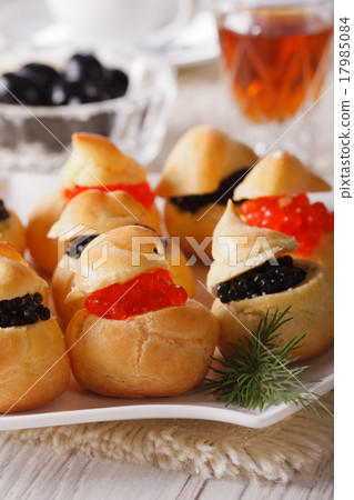 profiteroles stuffed with red and black caviar  17985084