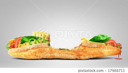 Huge sandwich with cheese, ham and green leaves 17988711