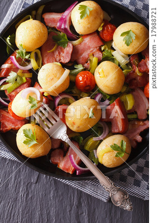 Fried bacon with potatoes close-up top view Fried bacon with potatoes close-up top view 17988721