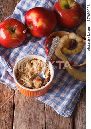 Traditional apple crumble close-up in a pot 17989028