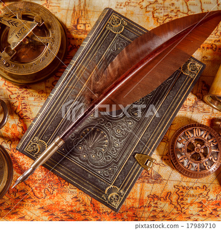 Vintage magnifying glass lies on an ancient world map 17989710