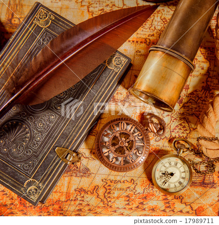 Vintage magnifying glass lies on an ancient world map 17989711