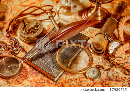 Vintage magnifying glass lies on an ancient world map Vintage magnifying glass lies on an ancient world map 17989715