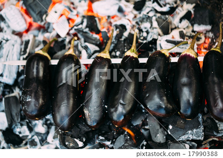 Eggplant on coals closeup. Eggplant on coals closeup. 17990388