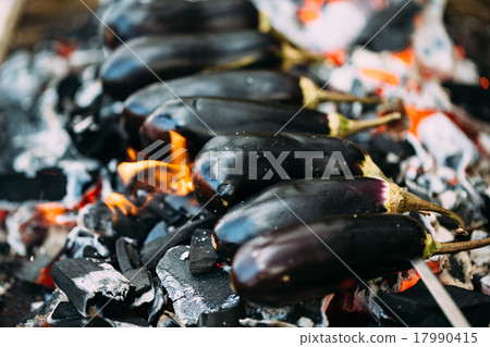 Eggplant on coals closeup. 17990415