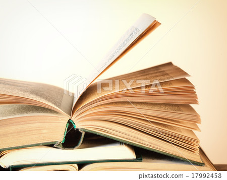 Old open novel books on a wooden table Old open novel books on a wooden table 17992458