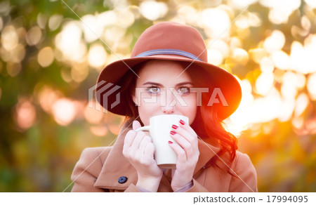 Woman with cup of tea or coffee Woman with cup of tea or coffee 17994095